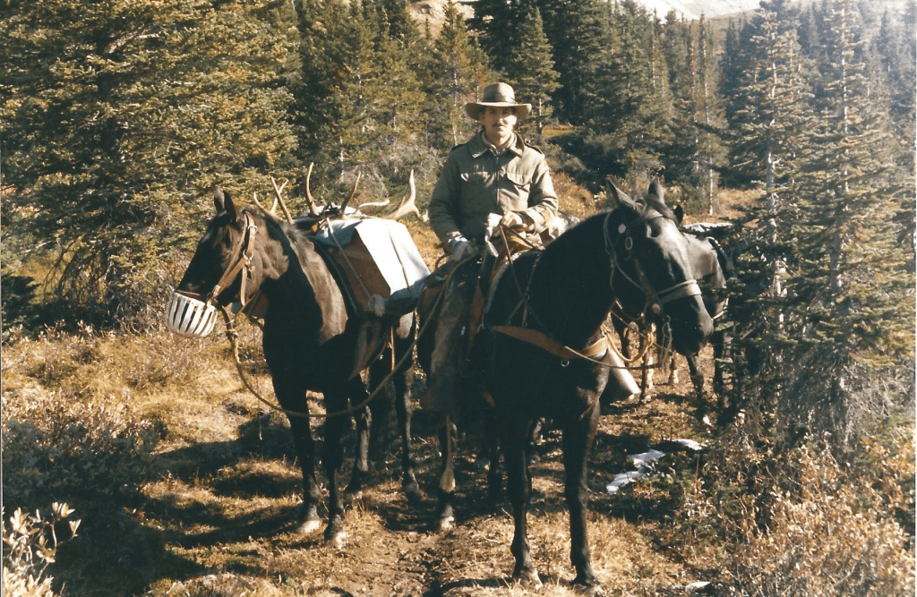 Bob Barker riding out of the Brazeau over Nigel Pass.  Riding Glag, leading Ranger