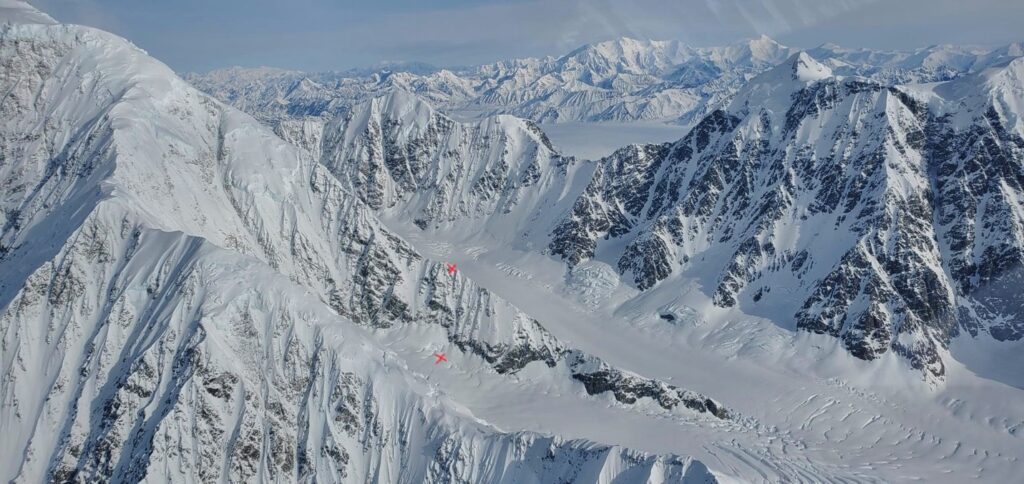 East ridge of Mt. Logan – red xs’ mark points on the ridge and in the cirque below marking the start and finish of their fall.
