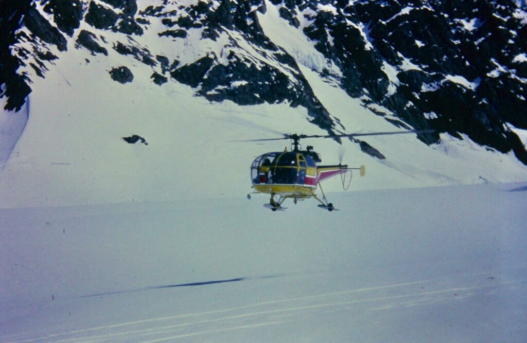 The Alouette 3 lands at Base Camp on our way in (note wheels and skis).
